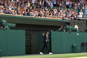 Roger Federer walks onto court during the Centre Court Centenary Celebration last year.