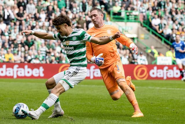 Celtic's Jota rounds Rangers goalkeeper Allan McGregor after a short passback from John Souttar to make it 3-1.  (Photo by Craig Williamson / SNS Group)
