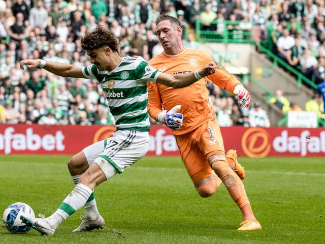 Celtic's Jota rounds Rangers goalkeeper Allan McGregor after a short passback from John Souttar to make it 3-1.  (Photo by Craig Williamson / SNS Group)