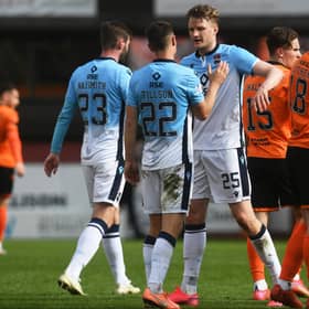 The Ross County players celebrate at full time after defeating Dundee United 2-0.