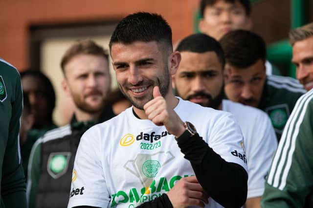Greg Taylor gives the fans a thumbs-up after Celtic's title success.
