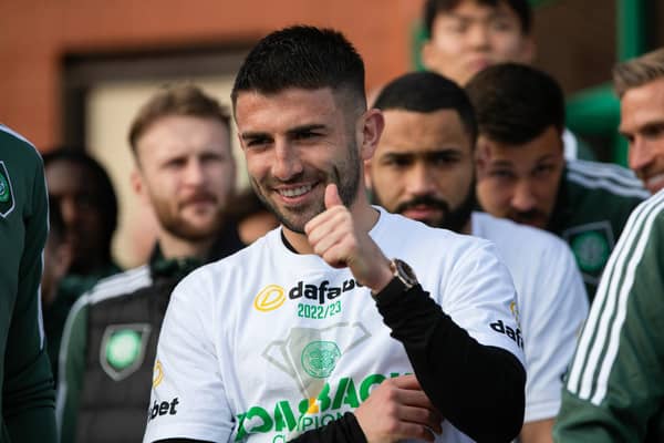 Greg Taylor gives the fans a thumbs-up after Celtic's title success.