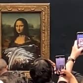 The cake smearing incident was captured by dozens of visitors to the Louvre Museum in Paris
Pic: YouTube