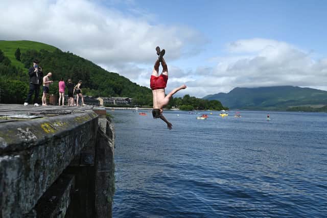 The hot weather saw Scots take the plunge at Loch Lomond. Picture: John Devlin