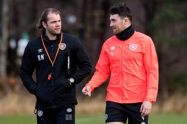 Hearts manager Robbie Neilson (left) and John Souttar (right) will continue working together for the remainder of this season.  (Photo by Ross Parker / SNS Group)
