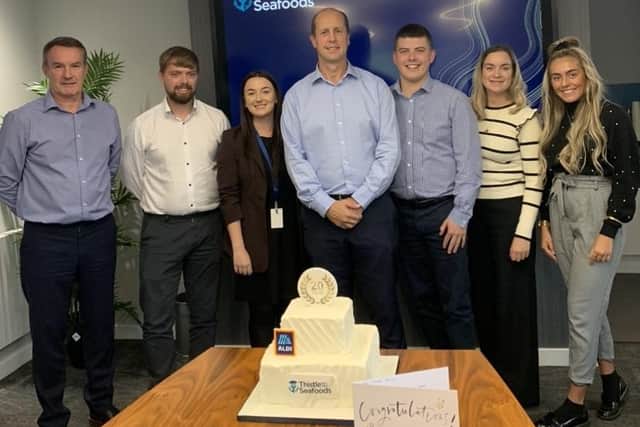 Stephen Main, Commercial Director and Ryan Scatterty, CEO. with the Aldi team.