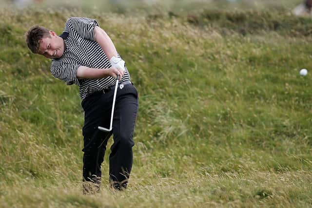 Stuart Wilson hits out of the during the first round of the 133rd Open Championship at Royal Troon. Picture: Adrian Dennis/AFP via Getty Images.