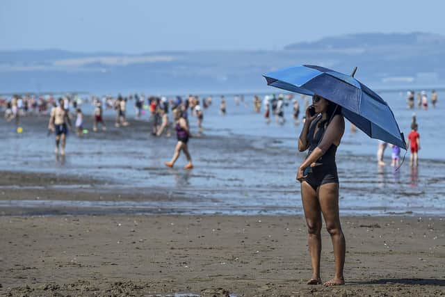 Scots are set to bask in the UK's hottest spring day of 2023. with the mercury expected to hit 25C on Wednesday -- but there will be a geographical divide, with the west expected to be as much as 10C warmer than eastern coasts. Picture: Lisa Ferguson