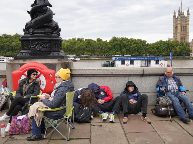Members of the public join the queue on the South Bank, as they wait to view the coffin of Queen Elizabeth II lying in state ahead of her funeral on Monday. Picture date: Wednesday September 14, 2022.