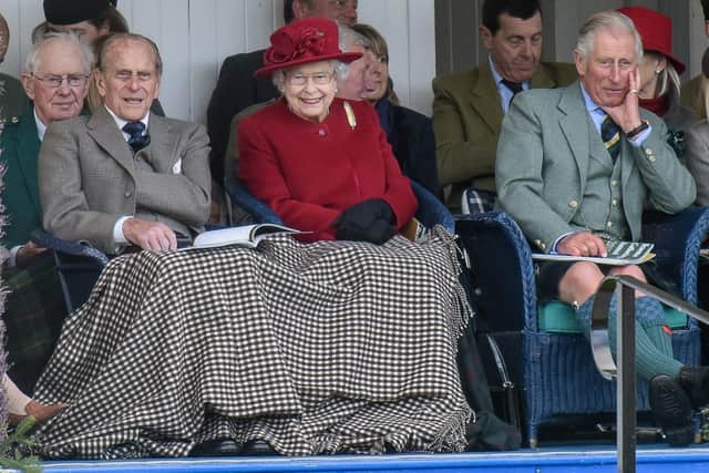 Prince Phillip, HRH Queen Elizabeth and HRH Prince Charles are pictured at the Braemar Gathering near Braemar, Aberdeenshire in 2015.  The event has been regularly attended by the reigning monarch and members of the Royal Family since 1848.