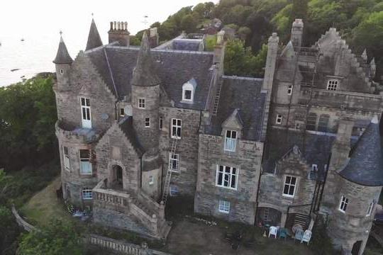 This baronial castle has recently made headlines by being in the centre of a legal battle, over two decades long, over an unsettled debt. Now, the castle is back on the market for £1.25 million. Built in the 1850s and set above the enchanting Loch Long, the luxurious estate hosts six bedrooms, four reception rooms, and many other charming features like turrets.