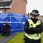 Police officers outside the home of Nicola Sturgeon and Peter Murrell as part of Operation Branchform.