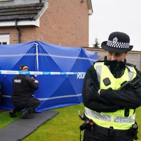Police officers outside the home of Nicola Sturgeon and Peter Murrell as part of Operation Branchform.