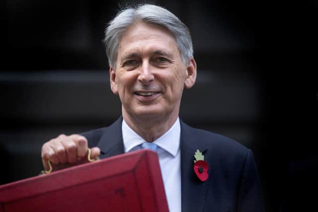 Philip Hammond, now Lord Hammond, poses outside 11 Downing Street before delivering his 2018 Budget. The former Chancellor is one of several senior Conservatives who object to Prime Minister Boris Johnson's plans to raise National Insurance contributions. Photo: Victoria Jones/PA Wire