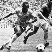In this file photo taken on June 21, 1970 Brazilian midfielder Pelé (L) dribbles past Italian defender Tarcisio Burgnich during the World Cup final in Mexico City.