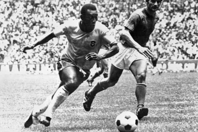In this file photo taken on June 21, 1970 Brazilian midfielder Pelé (L) dribbles past Italian defender Tarcisio Burgnich during the World Cup final in Mexico City.