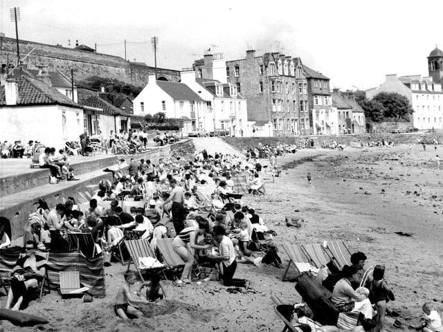 Holidaymakers enjoying the heat on the beach at Kinghorn in Fife in July 1966.