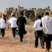 Israeli troops pictured yesterday near the border with Gaza (Picture: Menahem Kahana/AFP via Getty Images)