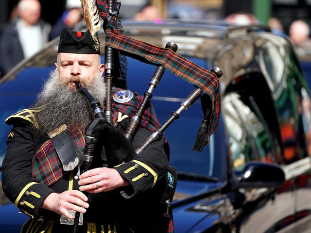 Pipers lead in the hearse ahead of a memorial service for former boxer Ken Buchanan at St Giles' Cathedral, Edinburgh.