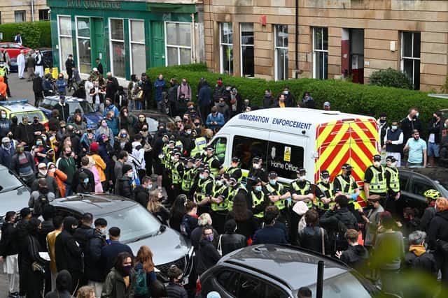 Scots residents block immigration van amid 'stand off' over Home Office raid in Glasgow.