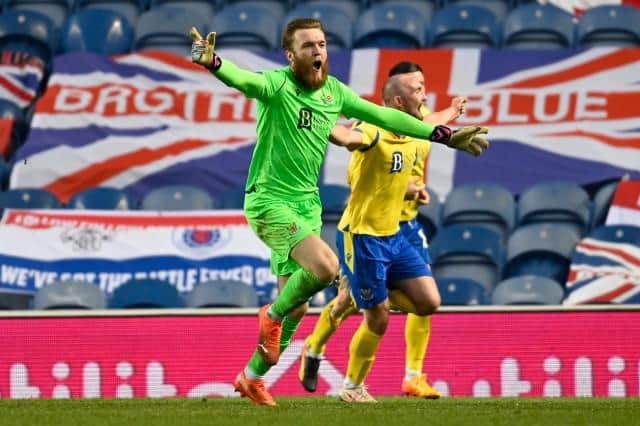 St Johnstone goalkeeper Zander Clark wheels away to celebrate his part in his team's dramatic 122nd minute equaliser against Rangers at Ibrox. (Photo by Rob Casey / SNS Group)