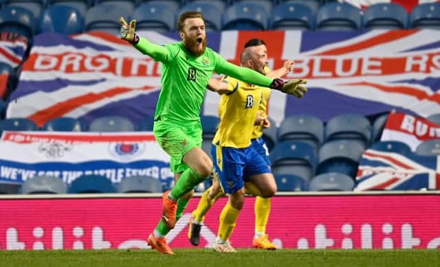 St Johnstone goalkeeper Zander Clark wheels away to celebrate his part in his team's dramatic 122nd minute equaliser against Rangers at Ibrox. (Photo by Rob Casey / SNS Group)