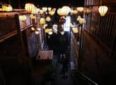 People walk along the Itaewon street of a deadly stampede during a Halloween festival  in Seoul, South Korea.