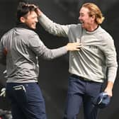 Ewen Ferguson gets a pat on the head from Sean Crocker after beating his course record from the previous day with an 11-under 61 in the second round of the Hero Open at Fairmont St Andrews. Picture: Ross Kinnaird/Getty Images.
