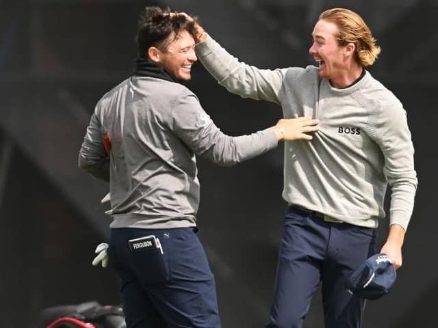 Ewen Ferguson gets a pat on the head from Sean Crocker after beating his course record from the previous day with an 11-under 61 in the second round of the Hero Open at Fairmont St Andrews. Picture: Ross Kinnaird/Getty Images.