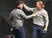 Ewen Ferguson gets a pat on the head from Sean Crocker after beating his course record from the previous day with an 11-under 61 in the second round of the Hero Open at Fairmont St Andrews. Picture: Ross Kinnaird/Getty Images.