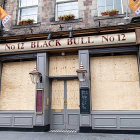 The Black Bull in Grassmarket, Edinburgh, is one of the many pubs in the city to be boarded up during the pandemic
