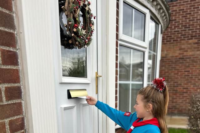 Beaver Scout posts Christmas card.