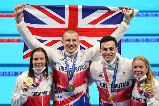 Great Britain's Kathleen Dawson, Adam Peaty, James Guy and Anna Hopkin with their gold medals for the Mixed 4 x 100m Medley Relay at the Tokyo Aquatics Centre. (Photo credit : Joe Giddens/PA Wire)
