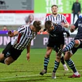 Lewis McCann heads home Dunfermline's equaliser.