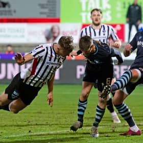 Lewis McCann heads home Dunfermline's equaliser.