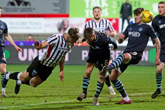 Lewis McCann heads home Dunfermline's equaliser.