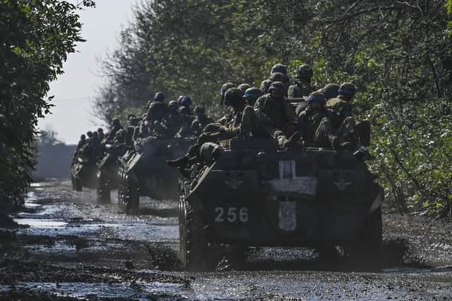Ukrainian soldiers ride on infantry vehicles in Novoselivka on Saturday, after making a series of stunning advances against Russian forces (Picture: Julian Barreto/AFP via Getty Images)