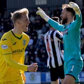 Hibs midfielder Ewan Henderson celebrates his goal at the SMiSA Stadium