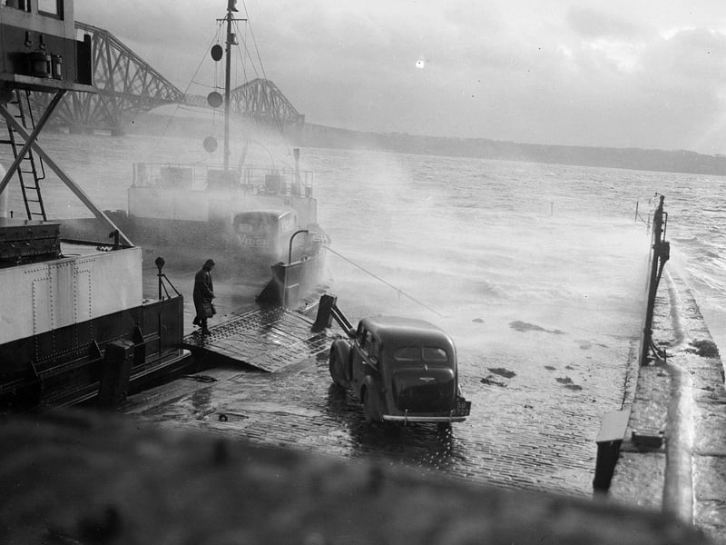 Stormy weather at North Queensferry as a car boards the ferry for the crossing of the Forth to South Queensferry in January 1953