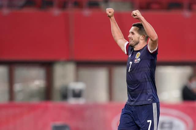 John McGinn celebrates Scotland's win in Vienna.