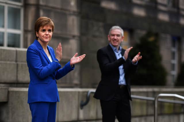 First Minister Nicola Sturgeon applauds outside St Andrew's House to salute health service and care workers during Thursday's nationwide Clap for Carers