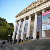 People wait in the queue to visit the exhibition of the World Press Photo at the Hungarian National Museum in Budapest.