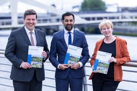 Former independence minister Jamie Hepburn, former first minister Humza Yousaf and Finance Secretary Shona Robison with one of the government’s independence papers.
