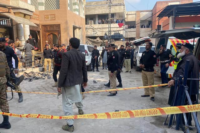Security personnel cordon off the site of a mosque blast inside the police headquarters in Peshawar. Picture: Maaz Ali/AFP via Getty Images