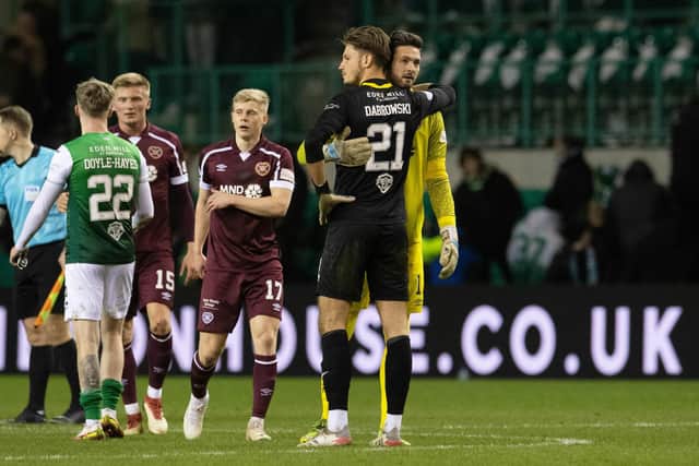 Hibs' Kevin Dabrowski shares and embrace with Hearts' Craig Gordon.  (Photo by Ross Parker / SNS Group)
