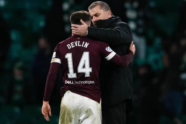 Celtic manager Ange Postecoglou offers words of encouragement to Hearts' Cammy Devlin after the clubs' last meeting with the two having offered up commendations to each other before they lock horns again at Tynecastle on Wednesday. (Photo by Craig Foy / SNS Group)