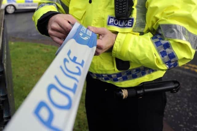 Up to a dozen people were involved in an incident which left a man seriously injured, detectives said as they bid to trace a man seen running nearby.