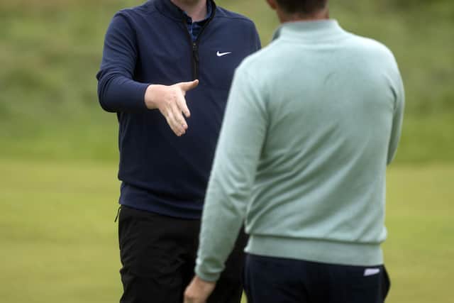Ryder Cup contender Bob MacIntyre shakes hands with 2021 European captain Padraig Harrington after they played together in the final round of the 151st Open at Royal Liverpool on Sunday. Picture: Tom Russo/The Scotsman.