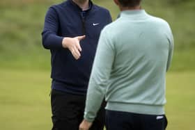 Ryder Cup contender Bob MacIntyre shakes hands with 2021 European captain Padraig Harrington after they played together in the final round of the 151st Open at Royal Liverpool on Sunday. Picture: Tom Russo/The Scotsman.