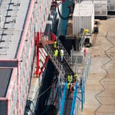 Workers at the Bibby Stockholm accommodation barge at Portland Port in Dorset, which will house up to 500 people.